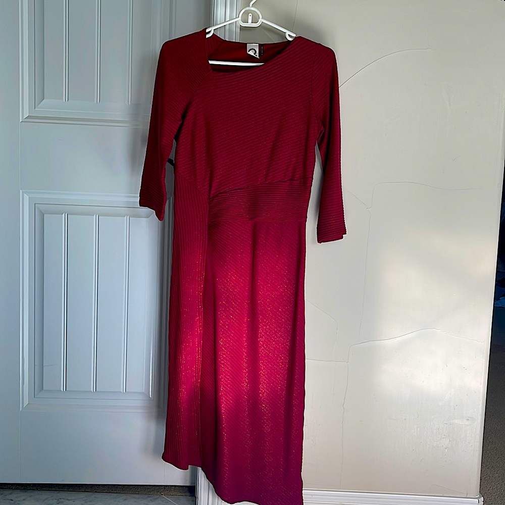 Beautiful crimson color with subtle sparkle in fabric. Fitted, with stretch.